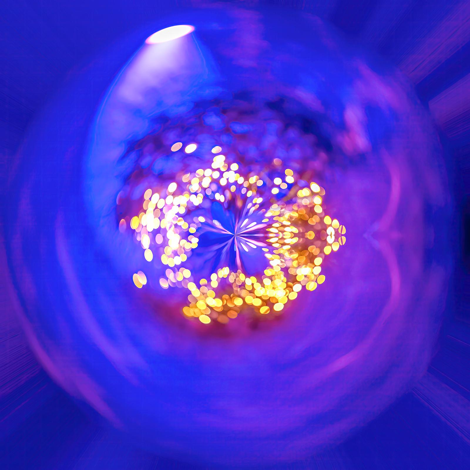 Purple Light, a spiral of golden lights against a circular blue and violet composition, photograph by Paul Marnef
