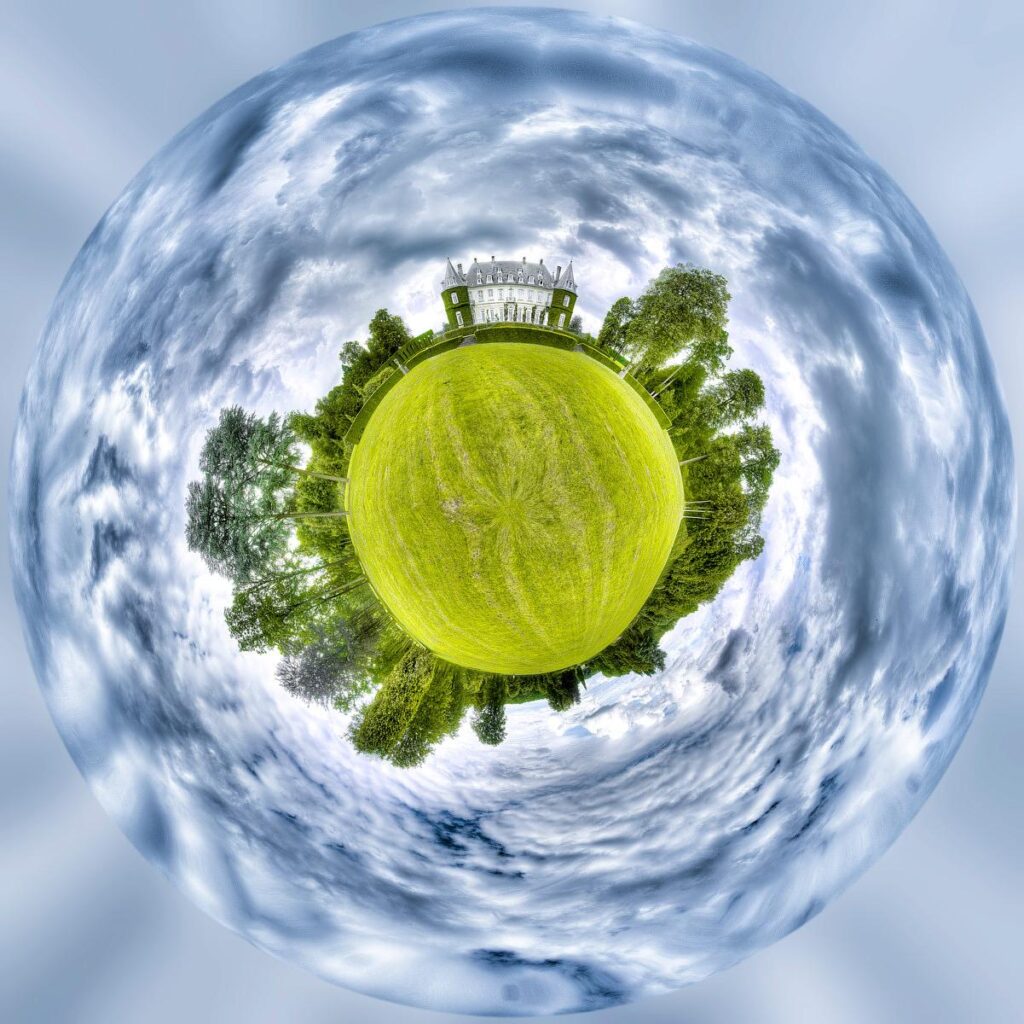 A white castle and its grounds form a tiny planet surrounded by a swirling, cloudy sky.
