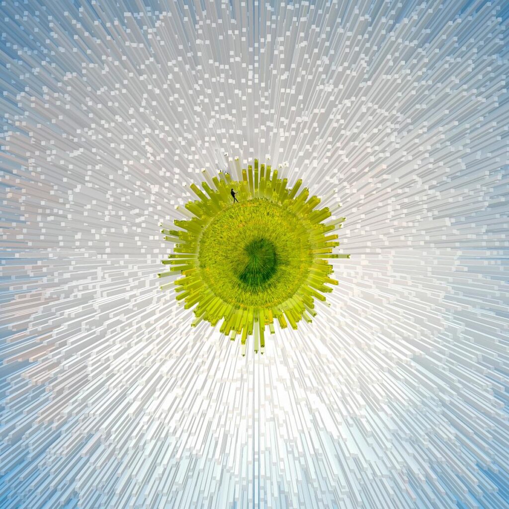 An exceptional bird’s-eye view of the Astral Walker: a tiny black figure walks in the centre of a disc of vibrant greenery, radiating thousands of translucent white thorns that shoot out radially towards the blue sky.